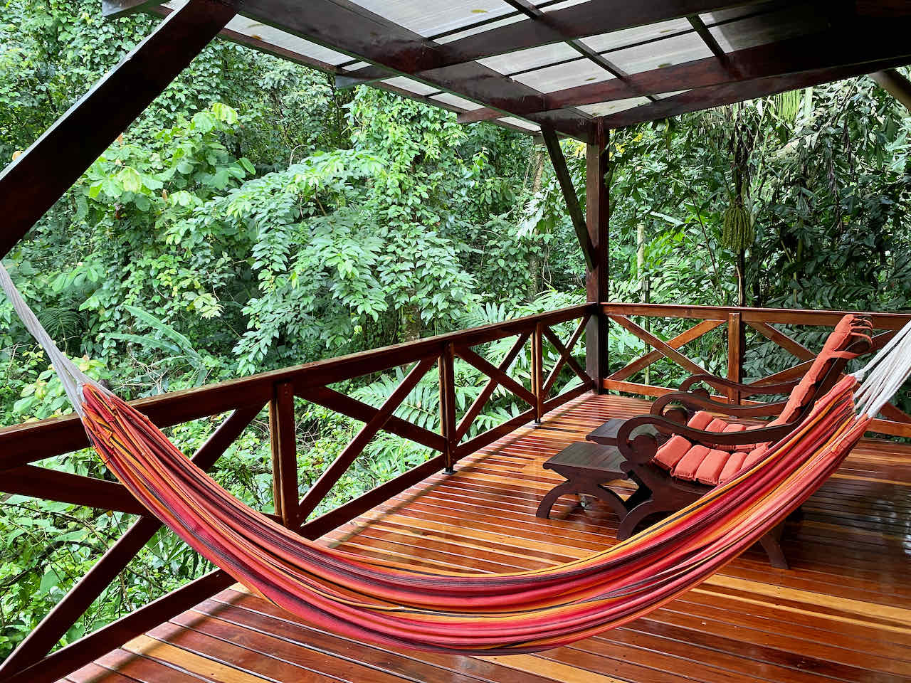Hammock on deck in the rainforest with private plunge pool at Nayara Springs Resort in Costa Rica. 