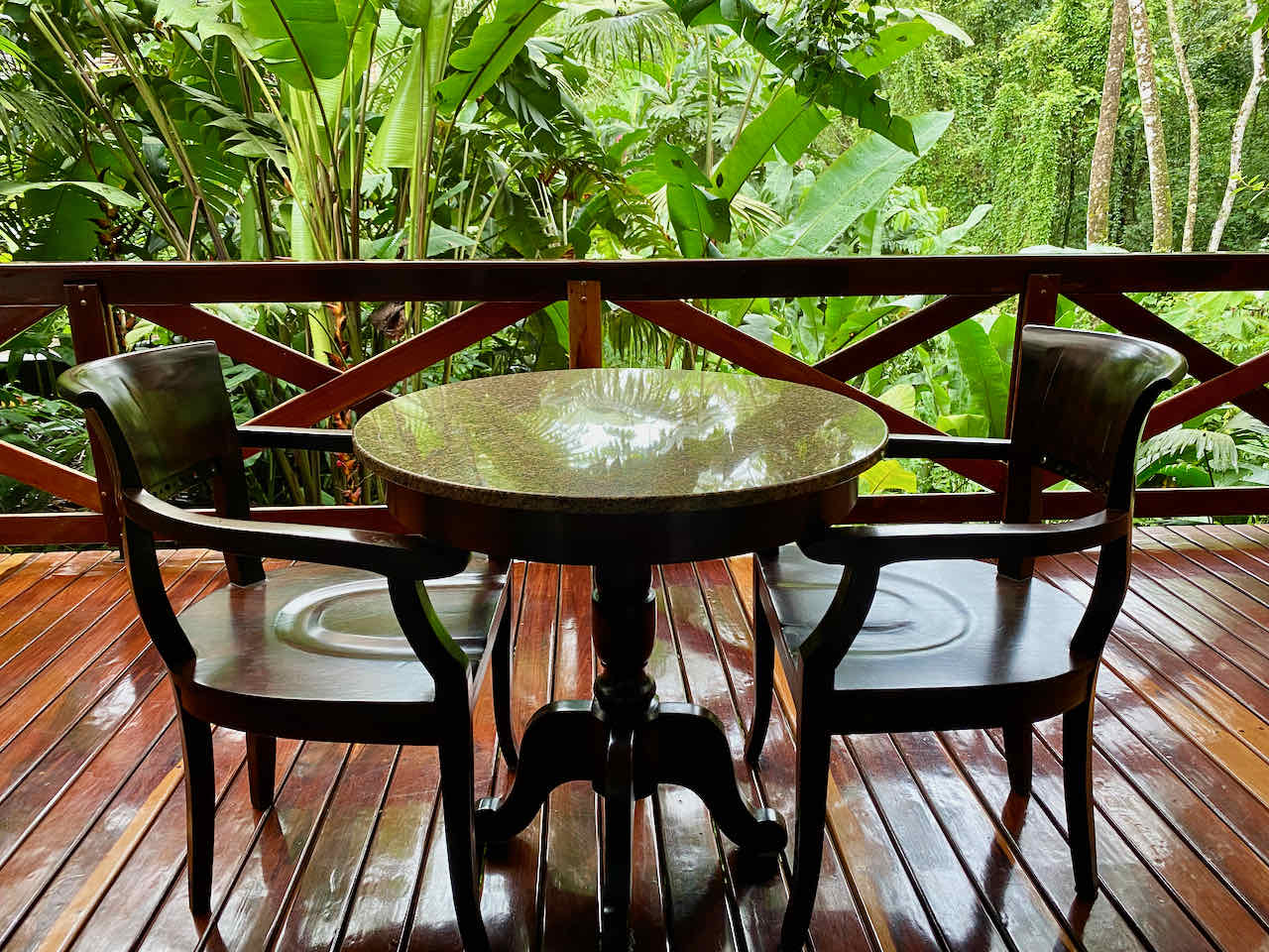 Table on the deck in the rainforest with private plunge pool at Nayara Springs Resort in Costa Rica. 