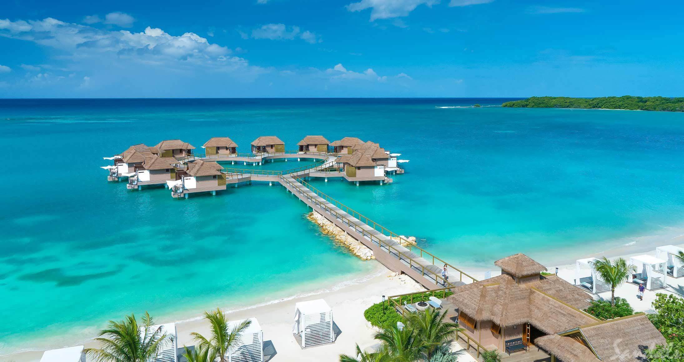 Overwater bungalows in the Caribbean at Sandals South Coast in Jamaica.