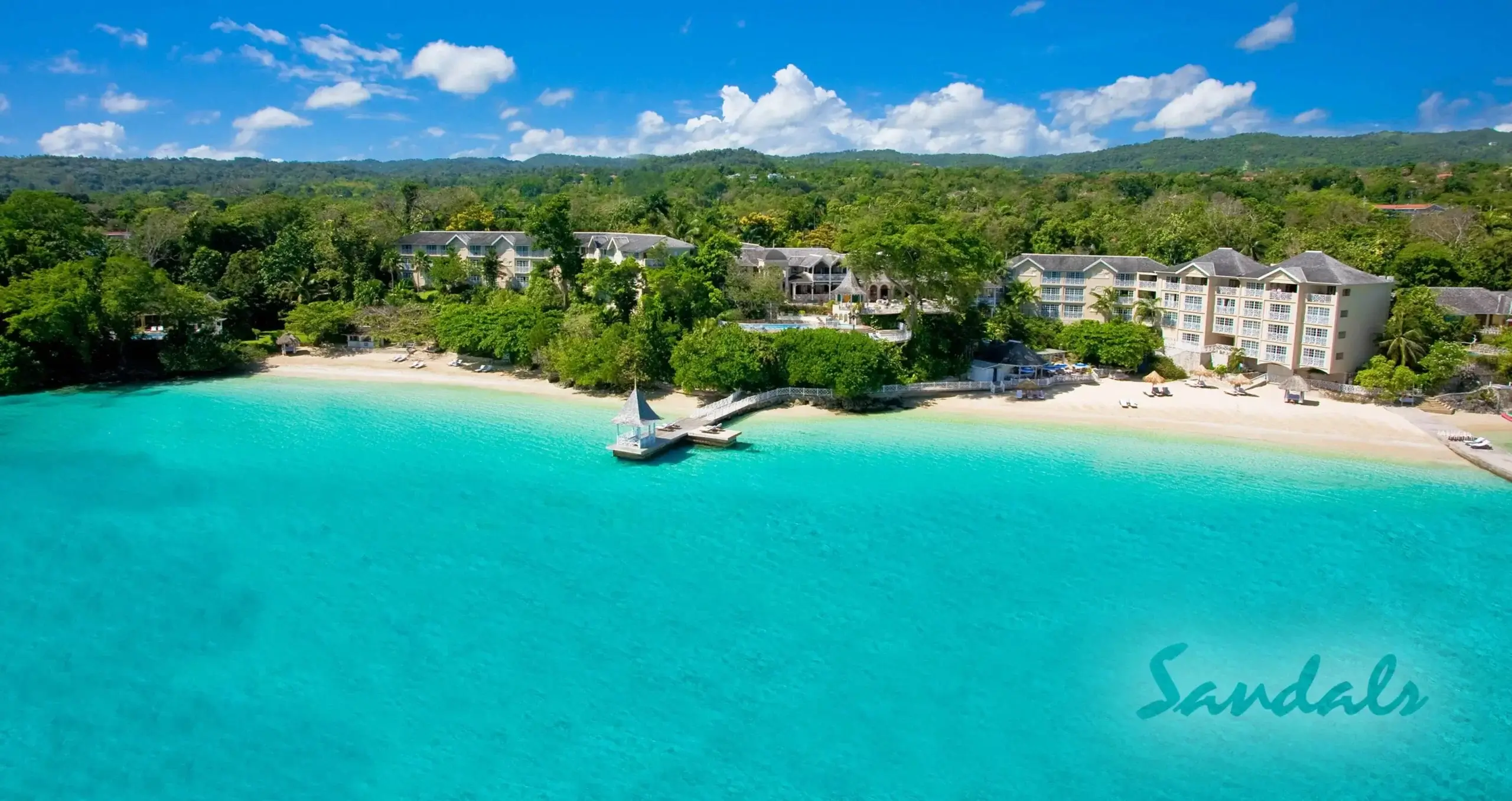 Sandals Royal Plantation in Jamaica with white sand beach and clear blue water. 