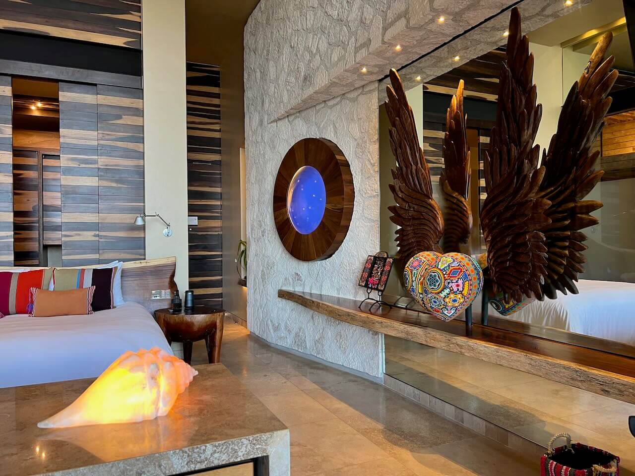 Hotel room with natural materials at La Casa de la Playa luxury hotel in Mexico.