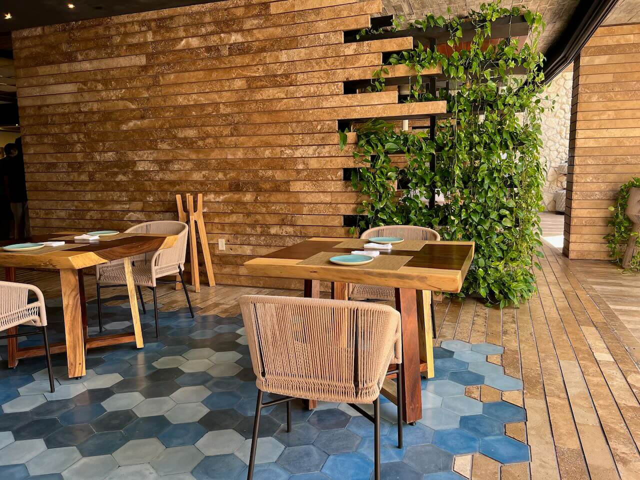Wood and stone dinning room at Estero at La Casa de la Playa luxury hotel in Mexico.