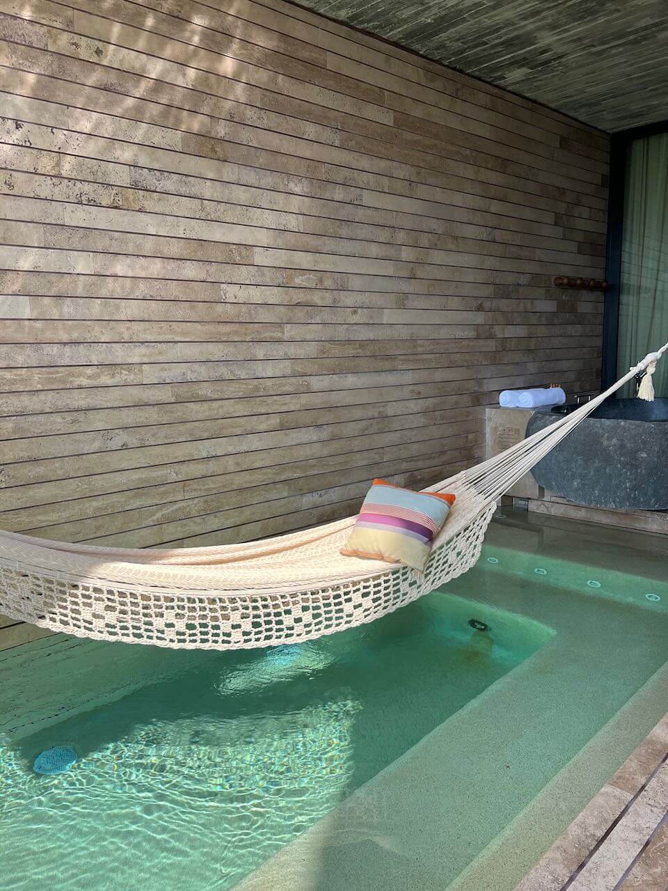 Hammock over private pool in luxury room at La Casa de la Playa luxury hotel in Mexico.