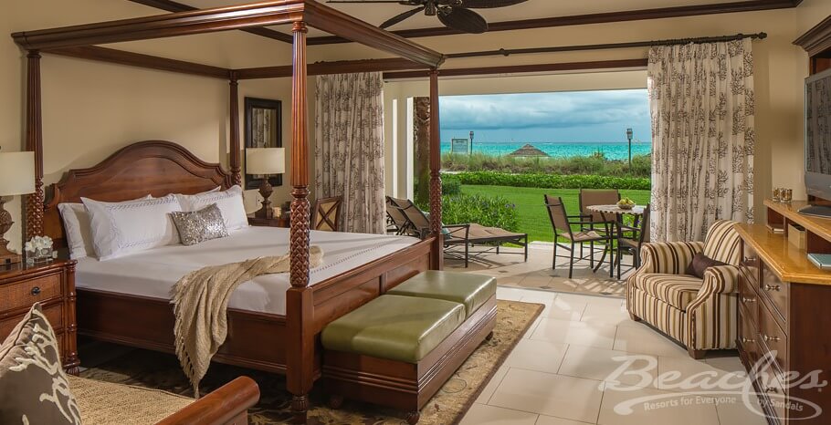 beautiful beachfront room with four poster kind bed