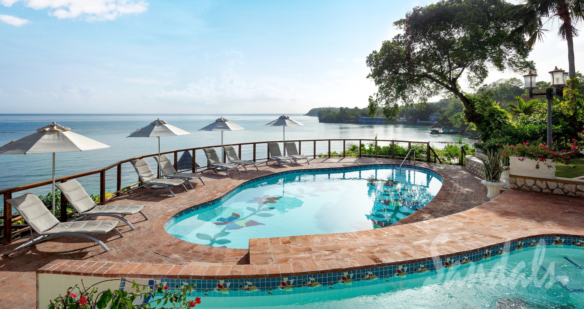 Best Sandals honeymoons at Sandals Royal Plantation in Jamaica on white sand beach.